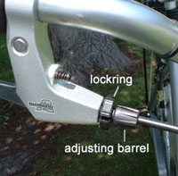 Turn the adjusting barrel to tighten the brake